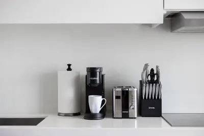 a kitchen counter with various appliances on a counter top at Sky-High Penthouse Breathtaking City Views in Toronto