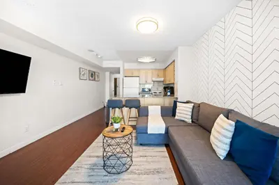 a living room with a couch and a table at Downtown Toronto Studio Retreat in Toronto