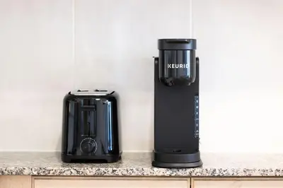 a kitchen counter with a coffee maker and a toaster at Downtown Toronto Studio Retreat in Toronto