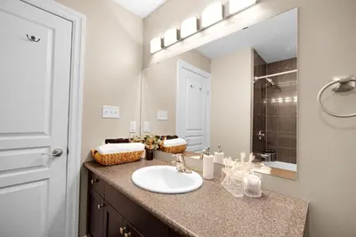 a bathroom with a sink and a mirror at Pool, King Bed, Patio with BBQ, Fall Hiking Nearby in Cambridge