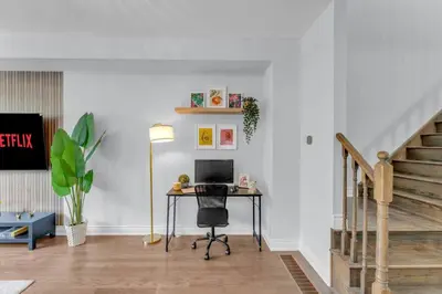 a room with a desk with a computer on it at Chic Open-Concept 5 Beds Home by Airport and Highways in Brampton