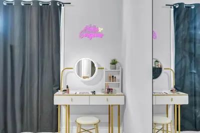 a dressing room with a vanity and mirrors at Chic Open-Concept 5 Beds Home by Airport and Highways in Brampton