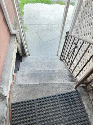 a set of stairs leading up to a house at Relax in East York Space Share in Toronto