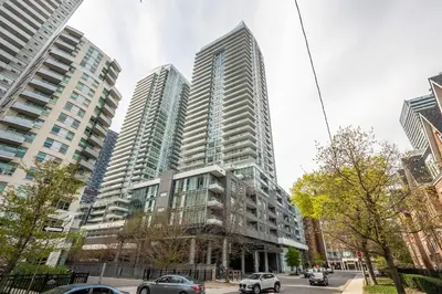 a group of tall buildings in a city at luminous 2-Bedroom Apartment with Balcony in Toronto