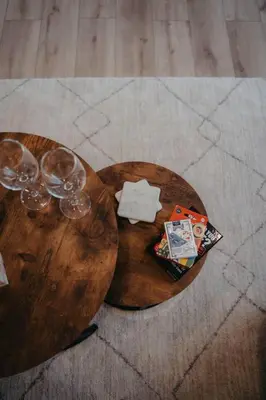 a wooden table with three wine glasses on it at The Hideout in Barrie