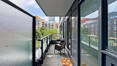 a balcony with a view of a city at Cozy 1BR Condo in Core Toronto in Toronto