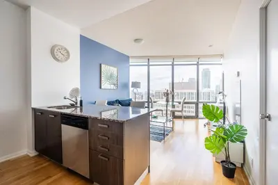 an open kitchen with a counter and a dining room at 1BR High Floor View Downtown Toronto in Toronto