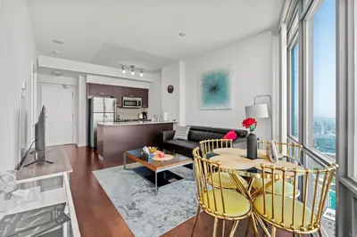 a living room with a couch and a table at Magnificent 1 Bd High floor view Downtown Toronto in Toronto
