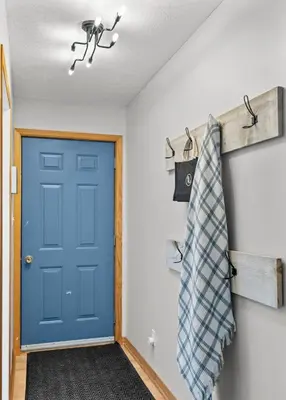 a door in a room with a blue door at Sunset Heaven 3 Bedroom Lakefront Retreat in Bracebridge