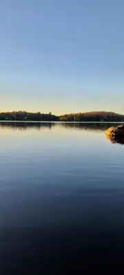 a large body of water with trees in the background at Sunset Heaven 3 Bedroom Lakefront Retreat in Bracebridge