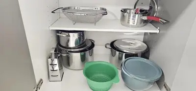 a cupboard filled with pots and pans at Muskoka Luxury Getaway in Gravenhurst