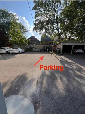 a view of a parking lot with a red arrow at Entire 2BR Apt in Midtown Toronto, walk to Subway & Shops in Toronto