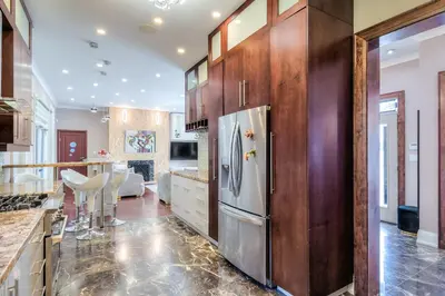 a kitchen with a stainless steel refrigerator in a room at Private Oasis in King City in King City