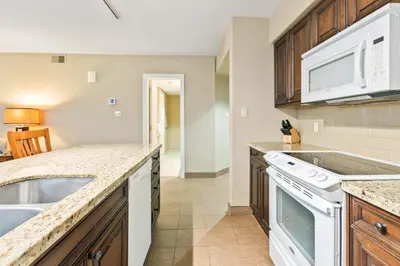 a kitchen with a sink and a stove at Gym,Pool,PetFriendly,KingBeds in Shanty Bay
