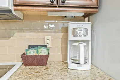 a coffee maker sitting on a counter next to a sink at Gym,Pool,PetFriendly,KingBeds in Shanty Bay