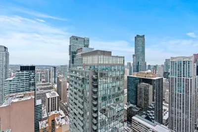 an aerial view of a city with tall buildings at Attractive 1 Bedroom High Floor with Skyline View in Toronto