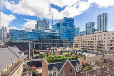 a view of a city with tall buildings at Modern Down Town Condo Near CN Tower with Fast WiFi in Toronto