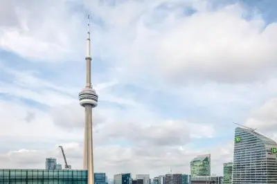 a view of the toronto skyline with the cn tower at Down Town CN Tower View 2BR Condo with Balcony and WiFi in Toronto