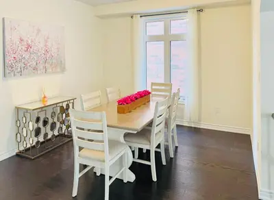 a dining room with a table and chairs at Beautiful Brand New House in Keswick 8 guests in Georgina
