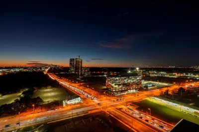 a city lit up at night with traffic at Panoramic view Condo 2 BR 2 BA Free parking in Toronto
