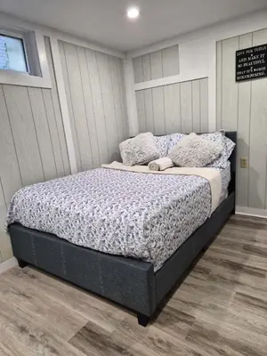 a bedroom with a large bed in a room at Equipped Basement Great Location in London