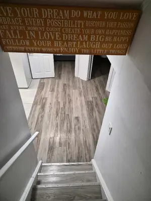a stairwell with a wall with a sign that reads love your dream do what at Equipped Basement Great Location in London