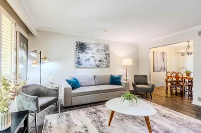 a living room with a couch and a table at Family-Friendly 2BR - Sleeps 6 in Hamilton