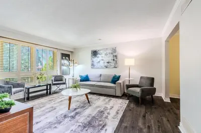 a living room with a couch and chairs and a table at Family-Friendly 2BR - Sleeps 6 in Hamilton