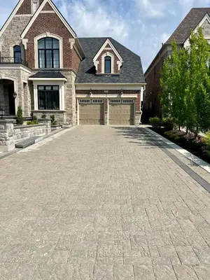 a brick driveway in front of a house at Secret Garden in Nobleton