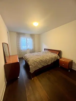 a bedroom with a bed and a dresser in it at Secret Garden in Nobleton