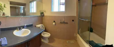 a bathroom with a sink and a toilet and a shower at Bright private single bedroom V02 on second floor in Mississauga
