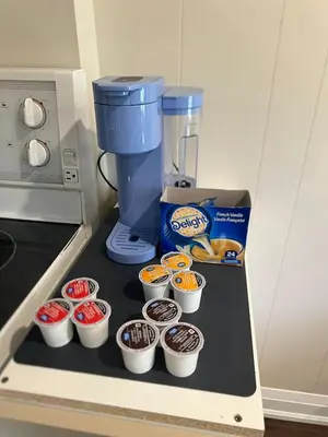 a counter top with cupcakes and a coffee maker at Bright & Cozy Bankfield Stay in Toronto