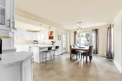 a kitchen and dining room with a table and chairs at Backyard Oasis in Bradford