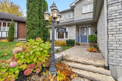 a street light in front of a house at Backyard Oasis in Bradford