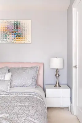 a bedroom with a bed and a lamp on a night stand at 1 Bedroom 26 Floor DT near CN Tower in Toronto