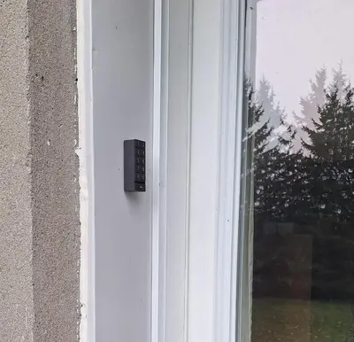 a window with a remote control on the side of a building at Century House on Quarter acre lot in Acton