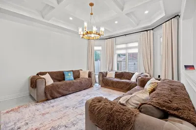 a living room with two couches and a chandelier at GlobalStay Luxury 4 Bedroom House Wonderland Vaughan in Vaughan