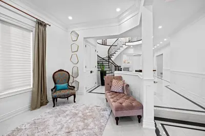 a living room with two chairs and a couch at GlobalStay Luxury 4 Bedroom House Wonderland Vaughan in Vaughan