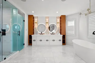 a bathroom with two sinks and two mirrors at GlobalStay Luxury 4 Bedroom House Wonderland Vaughan in Vaughan