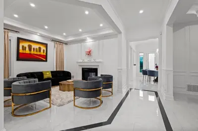 a living room with a couch and a table and chairs at GlobalStay Luxury 4 Bedroom House Wonderland Vaughan in Vaughan