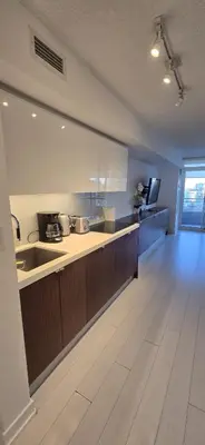 a kitchen with a counter and a sink in a room at Spectacular Large 3 Bedroom 3 Bath Condo Downtown Toronto Lakeview in Toronto