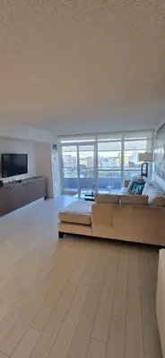 a large bedroom with a large bed and a television at Spectacular Large 3 Bedroom 3 Bath Condo Downtown Toronto Lakeview in Toronto