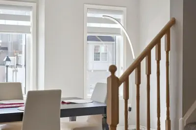 a dining room with a table and chairs and a window at The Devineridge Executive House in Ajax