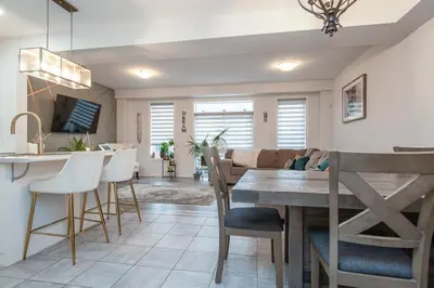 a kitchen and dining room with a table and chairs at Comfy 3 Bed woodstock Escape in Woodstock
