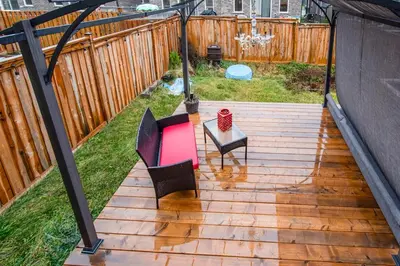 a patio with a table and chairs on a deck at Comfy 3 Bed woodstock Escape in Woodstock