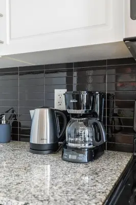 a kitchen counter with a blender on a counter top at 1 Bedroom Condo Bremner Blvd Downtown Toronto in Toronto