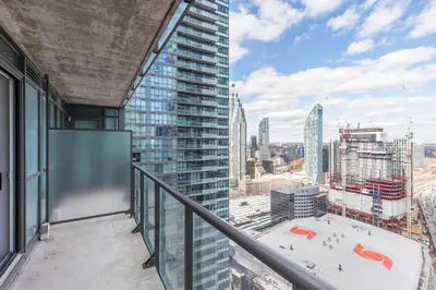 a balcony with a view of a city at 1 Bedroom Condo Bremner Blvd Downtown Toronto in Toronto