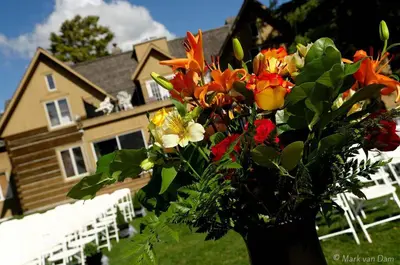 a vase of flowers in front of a house at Eganridge Resort, Golf Club & Spa in Bobcaygeon