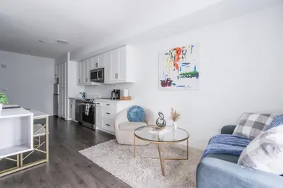 a living room with a couch and a table at Downtown Toronto luxury condos in Toronto