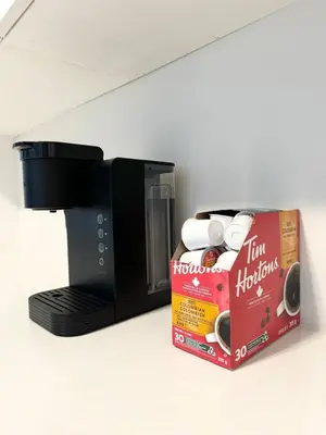 a coffee maker with a box next to it at New 3 Bedroom 2 Bathroom Home in West Niagara in Thorold